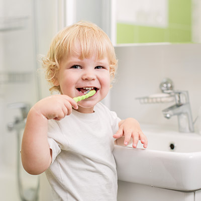 Baby brushing his teeth