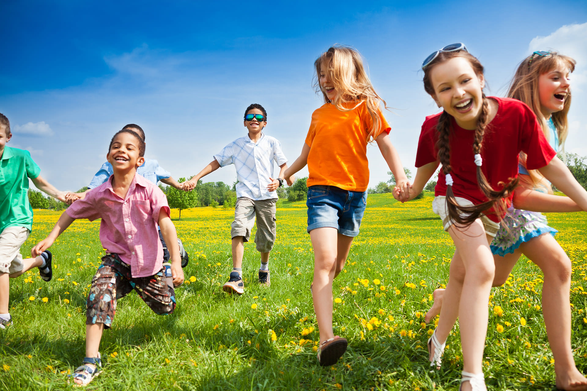 Kids running in field slide for Pediatric Dentist Dr. Mauricio Marcushamer in Downtown San Antonio, TX