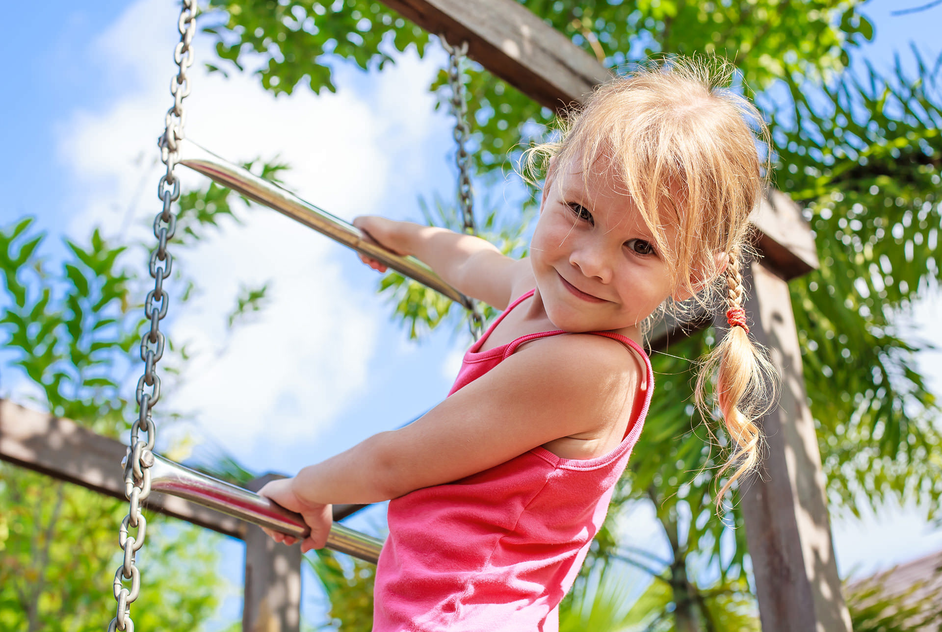 Girl climbing rope ladder slide for Pediatric Dentist Dr. Mauricio Marcushamer in Downtown San Antonio, TX 